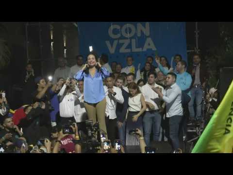 Machado celebrates with supporters as she leads Venezuela opposition primary