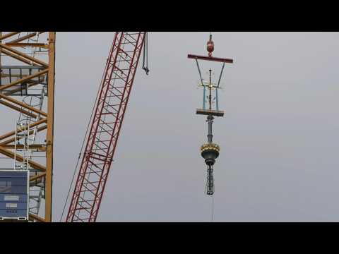 Cross for new spire installed on Paris' Notre-Dame cathedral