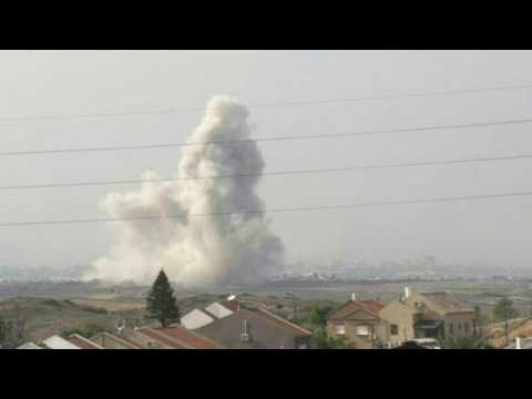 Strike in northern Gaza and smoke billowing, seen from Israel's Sderot