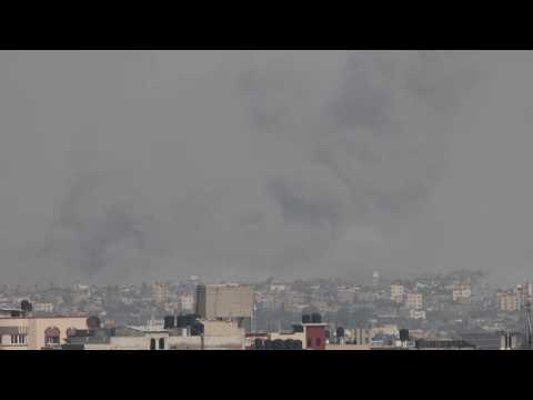 Smoke billows over Gaza's Khan Yunis, seen from Rafah