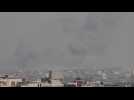 Smoke billows over Gaza's Khan Yunis, seen from Rafah