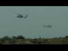 Israeli helicopters fly in and out of the Gaza Strip