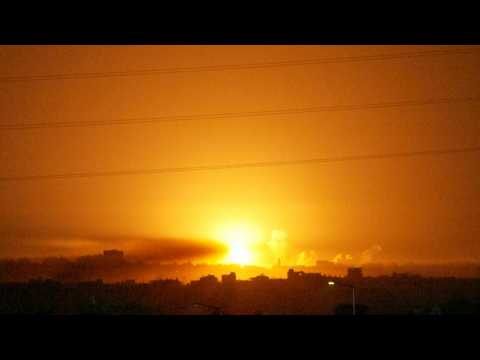 Strikes and flares tear up the night sky above Gaza