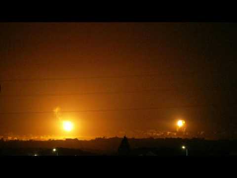 Strikes and flares are seen over northern Gaza from Israel's Sderot