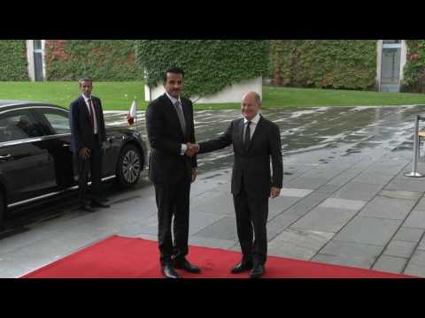 Handshake German Chancellor Scholz and Qatar's Emir Sheikh Tamim bin Hamad al-Thani