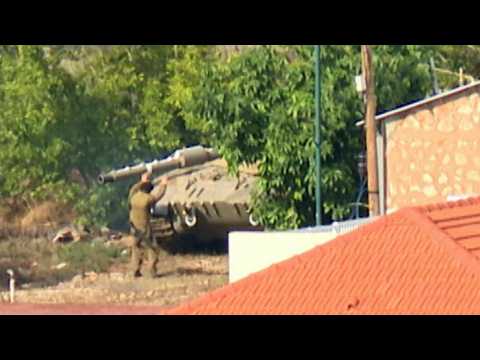 Tanks positioned in Israeli village on border with Lebanon