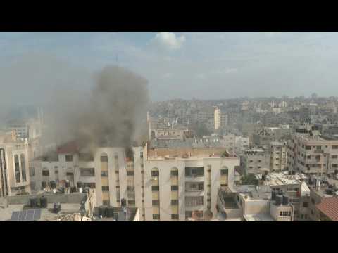 Israeli forces fire warning shot on a building in Gaza City