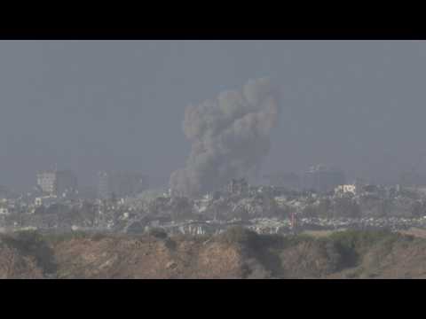 Large plumes of smoke and military activity at Israel-Gaza border