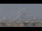 Large plumes of smoke and military activity at Israel-Gaza border