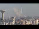 Smoke billows over Khan Yunis following Israeli strikes, seen from Rafah