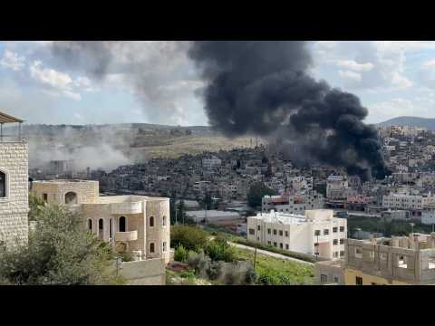 West Bank: smoke rises above Nur Shams camp during Israeli raid