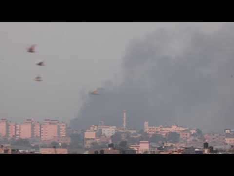 Smoke rises after an air strike in Khan Yunis seen from Rafah