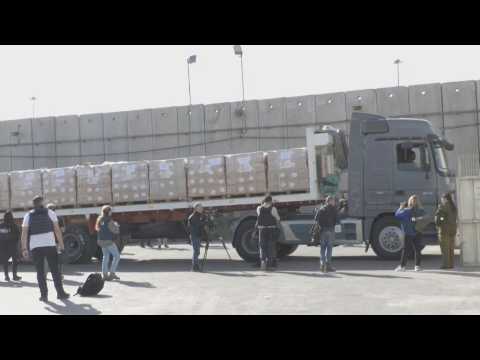 Gaza aid trucks go through security check at Kerem Shalom crossing
