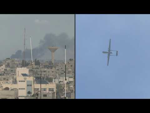 Smoke rises above Khan Yunis as Israeli drone flies over Rafah