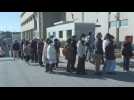 Japan: People line up for supplies at quake relief centre