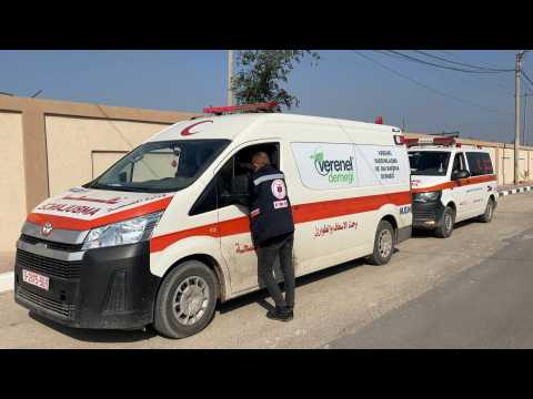 Aid trucks and ambulances in Gaza's Rafah
