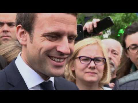 France's Macron visits cathedral as campaign wraps up