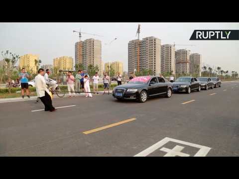 Balls of Steel! Tai Chi Master Pulls Four Cars with Bare Testicles