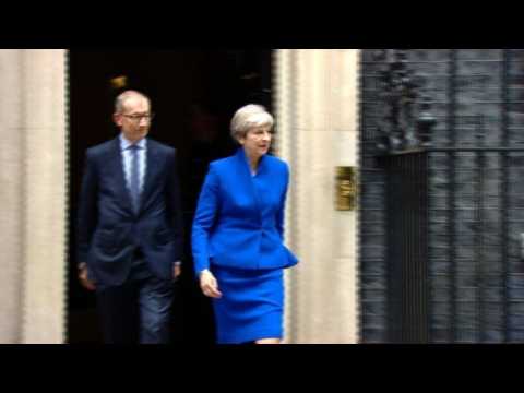 Theresa May leaves Downing St to meet Queen