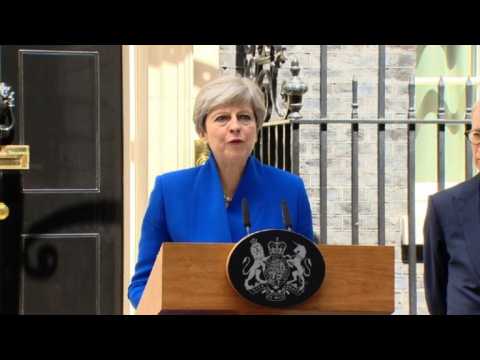 May says she will form new British government