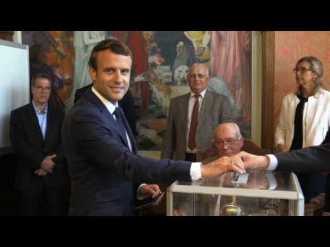 Macron votes in French parliamentary election