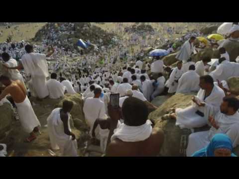 Pilgrims scale Mount Arafat for peak of hajj