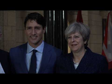 May pushes Britain-Canada free trade in Trudeau talks