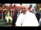 Pope bumps head on Popemobile in Colombia procession