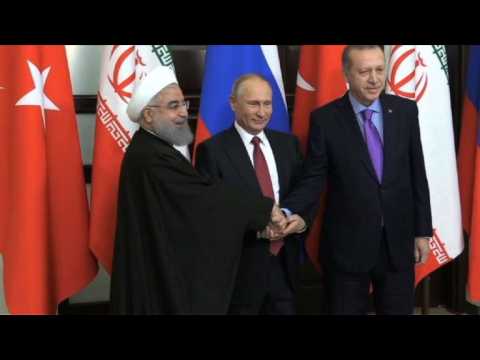 Putin meets with Iranian, Turkish presidents to talk Syria