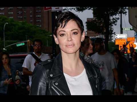 Rose McGowan hands herself in to police