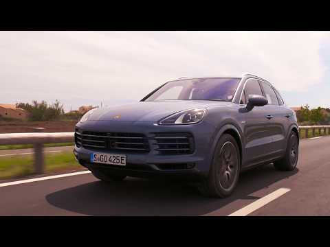 The new Porsche Cayenne E-Hybrid in Biskaya Blue Metallic Driving Video