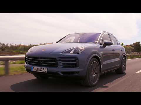 The new Porsche Cayenne E-Hybrid in Moonlight Blue Metallic Driving Video