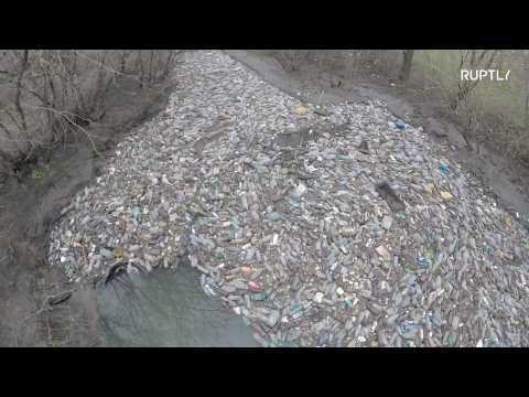 LITTERally clogged! Island of garbage blocks Russian river