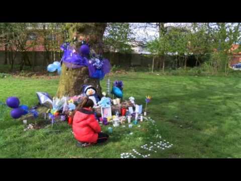 Mourners lay flowers after death of British toddler in Liverpool