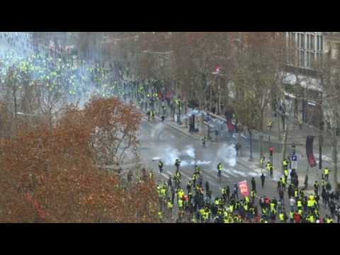 Police fire tear gas on Champs-Elysees' 'yellow vest' protests