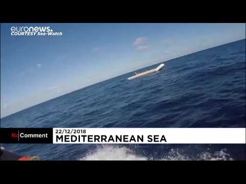 Dozens of rescued migrants stranded at sea wait for safe port