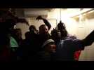 Migrants celebrate aboard the Sea Watch