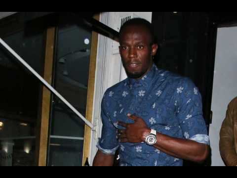 Usain Bolt surprises gym goers in London