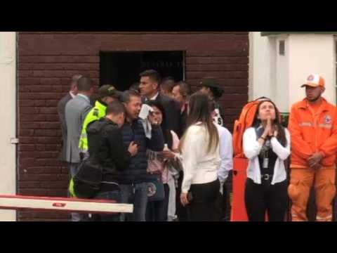 Relatives gather at the scene of apparent car bomb in Bogota
