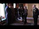 Theresa May and Jacinda Ardern meet military personnel