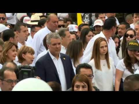 Colombian president joins thousands for march against violence