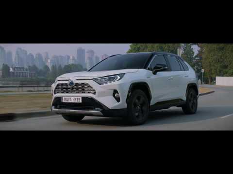 The new Toyota RAV4 Hybrid Driving in the country