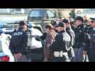 Cesare Battisti leaves airport escorted by police