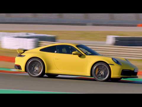 Porsche 911 Carrera 4S in Racing Yellow on the Race Track