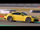 Porsche 911 Carrera 4S in Racing Yellow on the Race Track