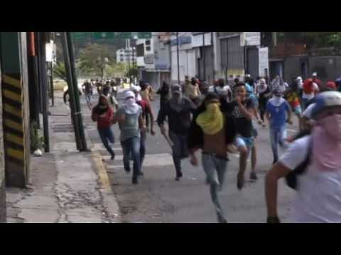 Protesters clash with police in Venezuela on day of mass protest