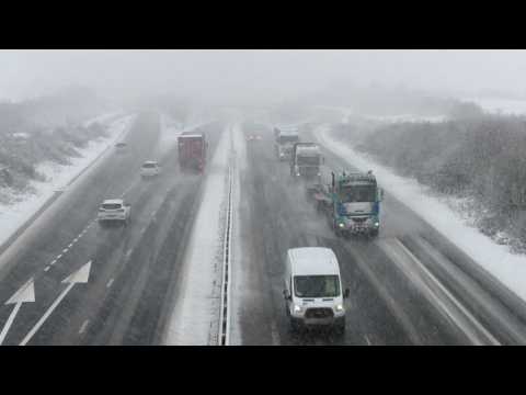 Wintry scenes and travel disruption as snow hits southern UK
