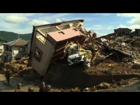 Desperate rescue efforts as Japan rains toll hits 75