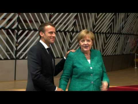 Macron, Merkel arrive at crunch migration summit in Brussels