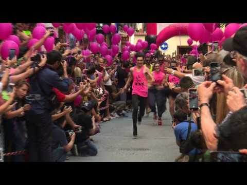 Fun at Madrid's Gay Pride as high heel racing takes place